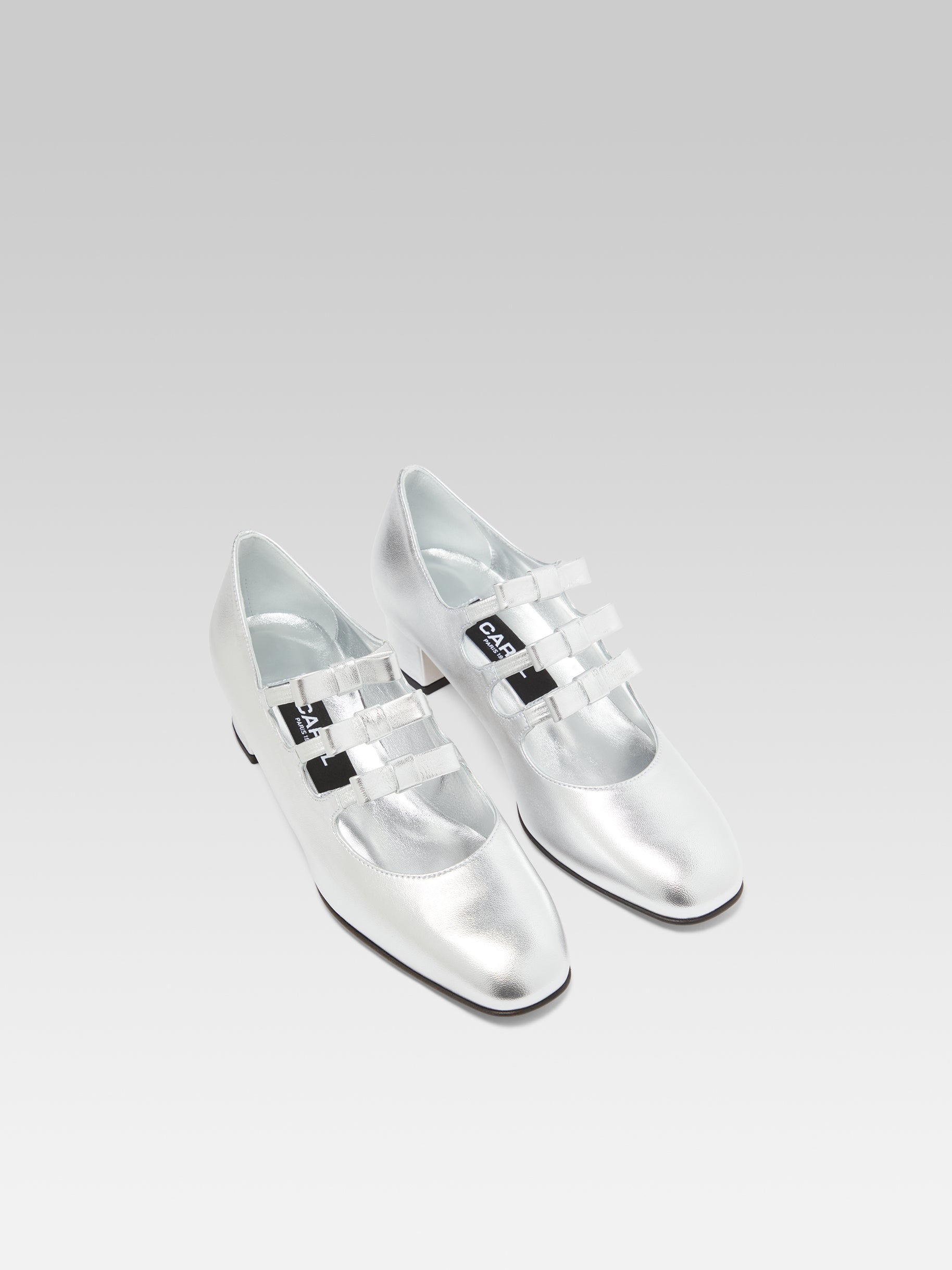 Kinette - Mary janes pumps with bows in silver laminated leather