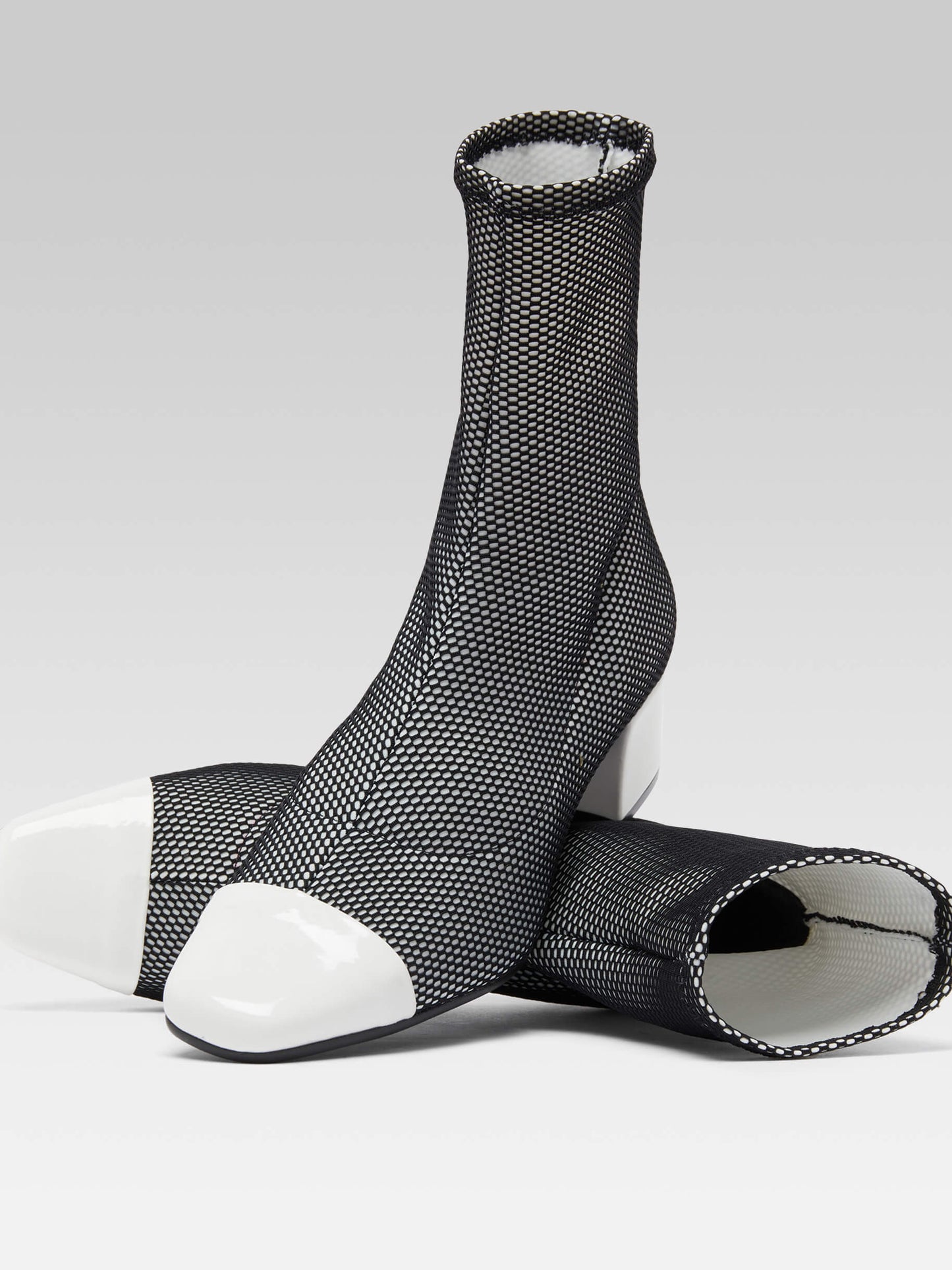 Estime - Black and white stretch fabric and white patent leather ankle boots