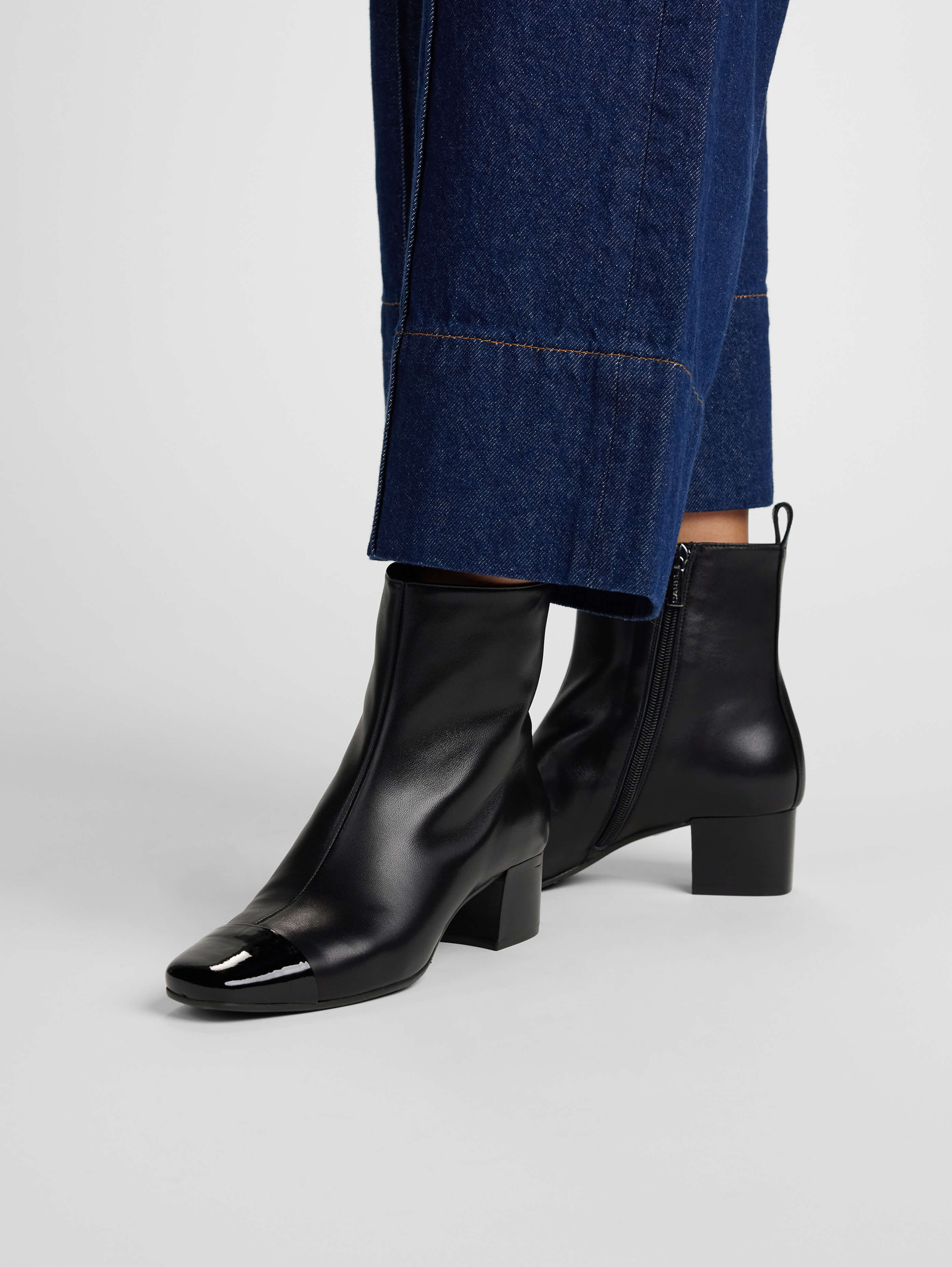 ESTIME Bi material leather and black patent ankle boots Carel Paris Shoes